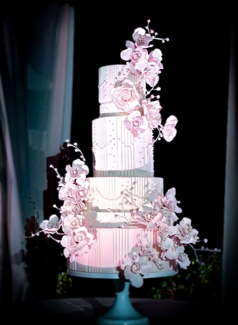 Pale pink and white tiered wedding cake with handmade sugar flowers at Villa Cimbrone in Ravello on the Amalfi Coast, Italy., Tuscan Wedding Cakes