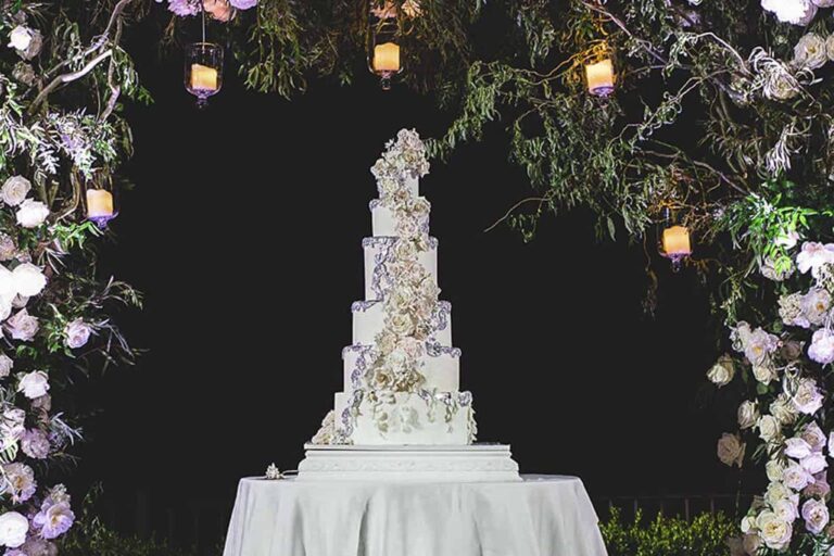 Wedding cake with a dramatic cascade of sugar flowers for Jack Wilshere at Castello di Casole, Tuscany, Tuscan Wedding Cakes