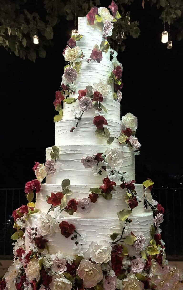 Luxury buttercream wedding cake adorned with intricate sugar flowers in Ravello, Italy for destination weddings, Tuscan Wedding Cakes