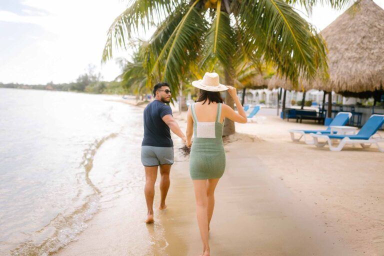 Couple walking along the beach, Umaya Resort and Adventures