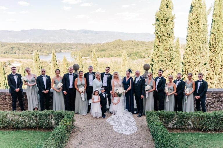 The whole party in the formal garden, cypresses behind, Umbria Weddings and Events