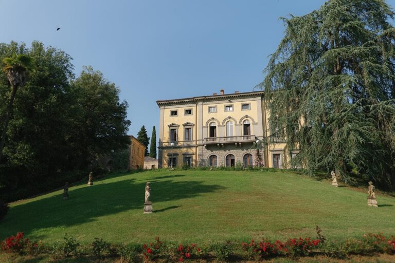 Villa Monaciano across its lawn, Umbria Weddings and Events