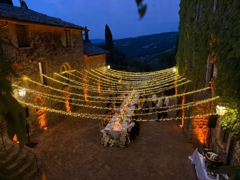 UMX Crew: Festoon lighting over a terrace dinner