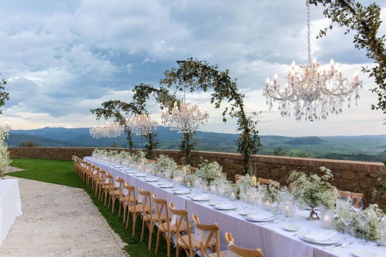 UMX Crew: A long table and floral arches