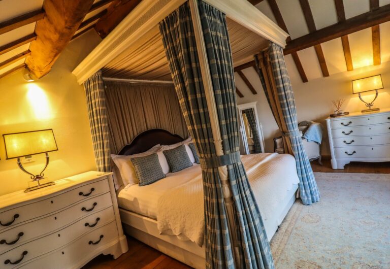 The Reservoir Room, with a canopied four-poster hung in tartan, Upper House Hayfield
