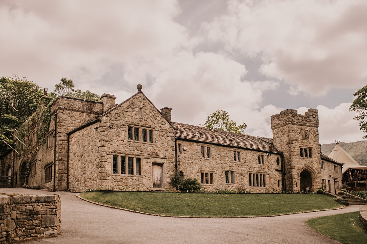 The front of the house and the castellated Solstice Tower seen from the drive, Upper House Hayfield