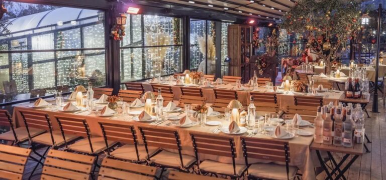 A long dinner table in the glass-walled hall, Urla Sahne