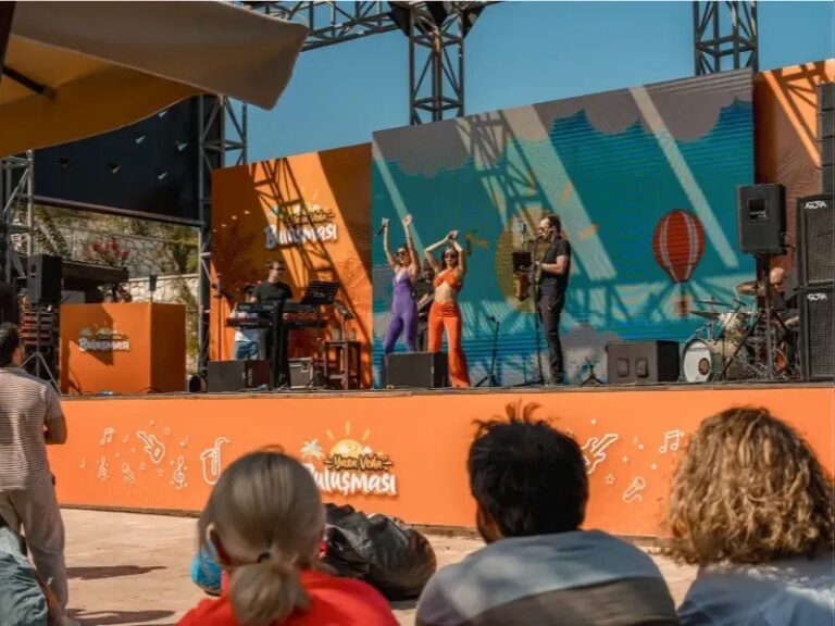The outdoor stage with performers and an audience, Urla Sahne