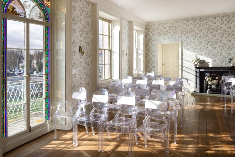 The Drawing Room laid for a ceremony, stained glass to the left, Valentines Mansion & Gardens