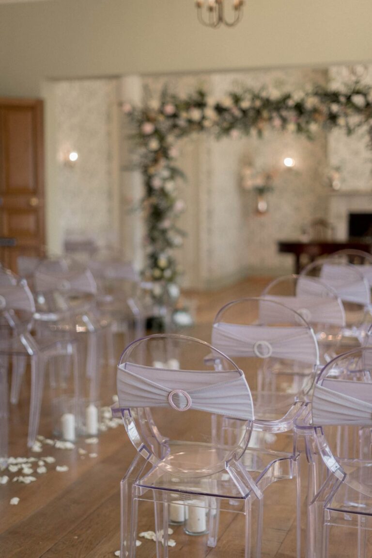 Ghost chairs and a foliage arch set for the ceremony, Valentines Mansion & Gardens