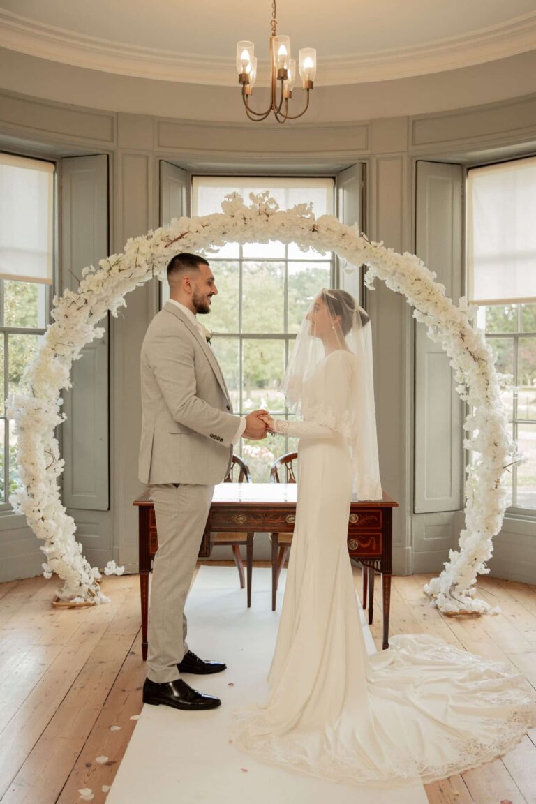 Vows exchanged beneath the floral moon arch, Valentines Mansion & Gardens