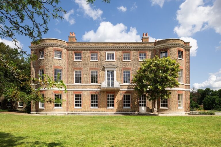 The south front of the 1696 mansion across the lawn, the first-floor balcony above the centre bay, Valentines Mansion & Gardens