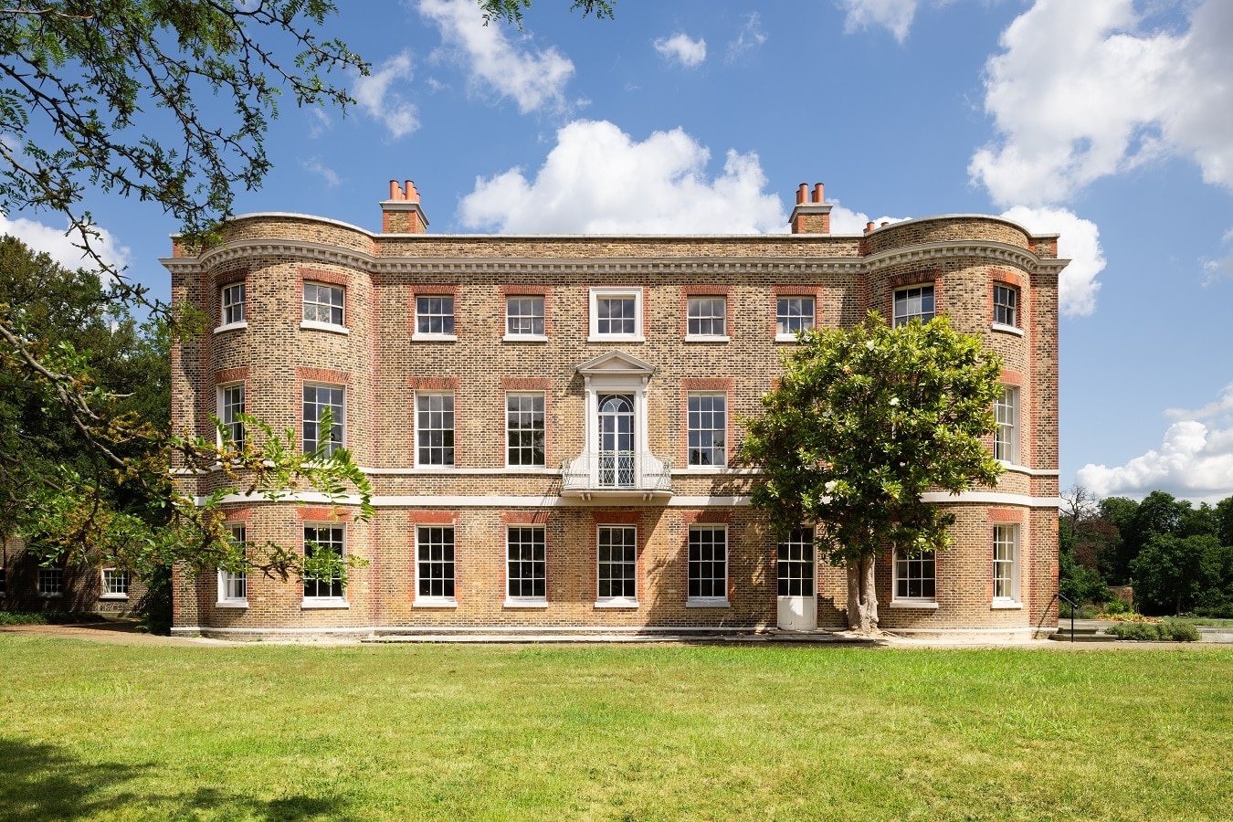 The south front of the 1696 mansion across the lawn, the first-floor balcony above the centre bay, Valentines Mansion & Gardens