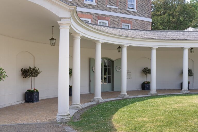 The colonnaded porte-cochere and its enclosed lawn, Valentines Mansion & Gardens