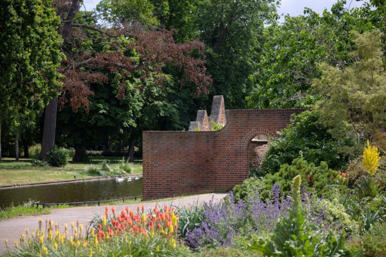The Dry Garden borders against the old brick wall and canal, Valentines Mansion & Gardens