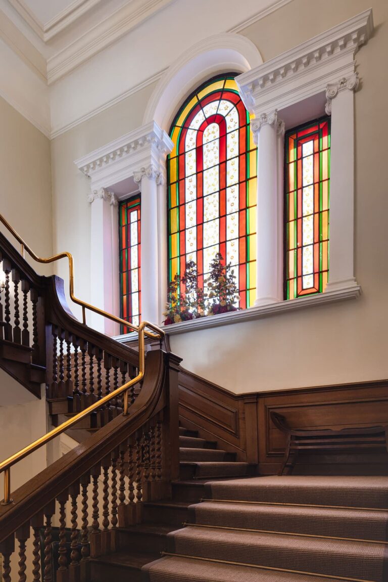 The grand staircase and stained glass, a vertical frame, Valentines Mansion & Gardens