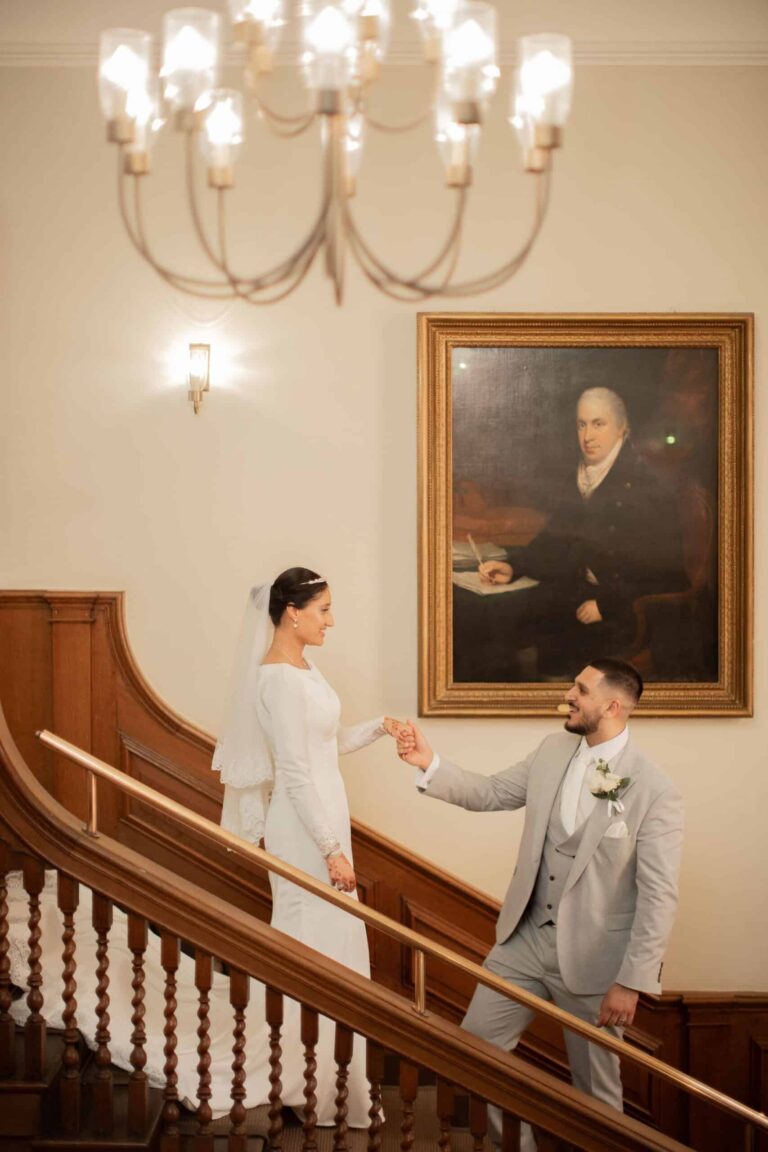 The couple descending the grand staircase, Valentines Mansion & Gardens