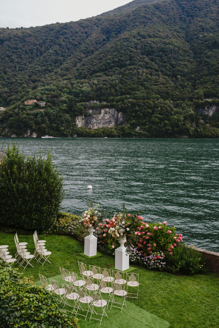 Lakeside ceremony chairs and flowers on the lawn, Lake Como, Vera Weddings