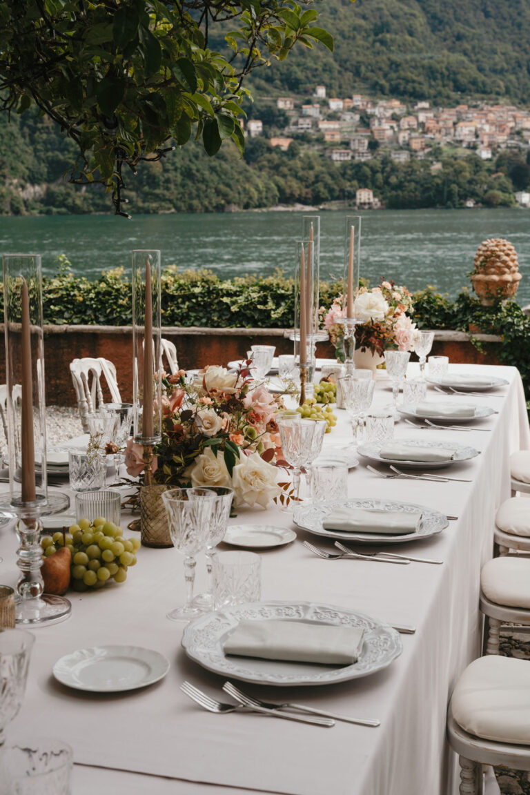 Reception table laid with flowers and glassware, Lake Como, Vera Weddings