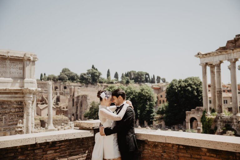 Couple embracing above the Roman Forum, Vera Weddings