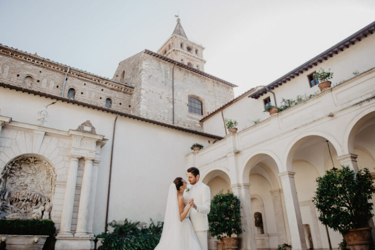Couple in a Roman cloister courtyard, Vera Weddings