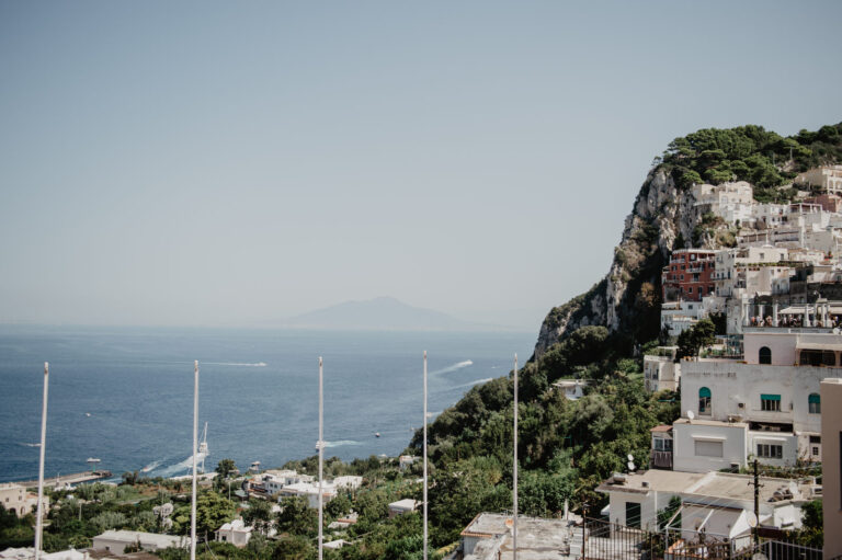 Cliffs and white houses of Capri above the sea, Vera Weddings