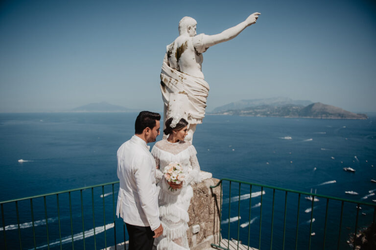 Couple beside a statue on a Capri belvedere, Vera Weddings