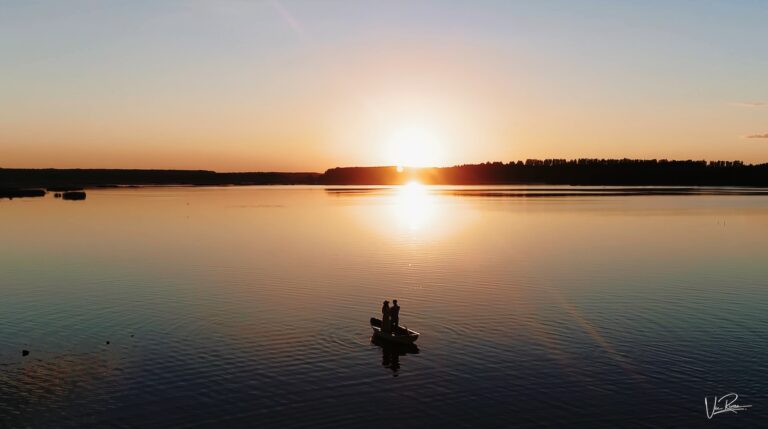 A couple in a small boat on a lake at sunset, from the studio showreel, Vic Rivero Films
