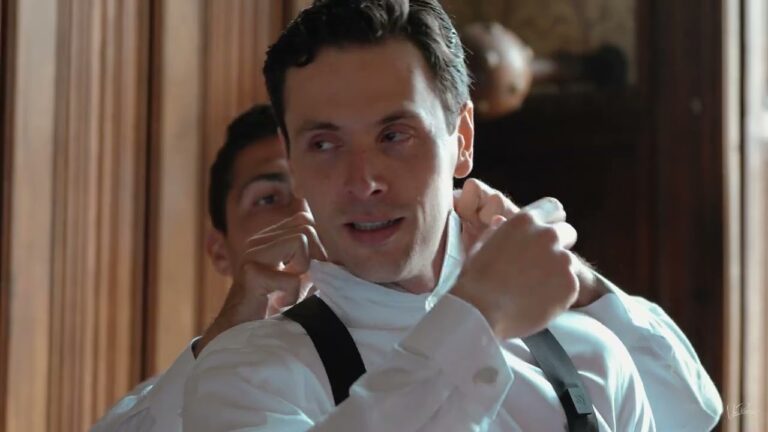 The groom dressing on the morning of Neeve and Kirsi's wedding at Château Challain, France, Vic Rivero Films
