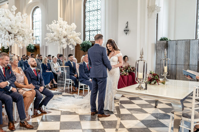 A ceremony on the chequered floor of the chapel at Hawkstone Hall, Shropshire, Victoria Amrose Photography