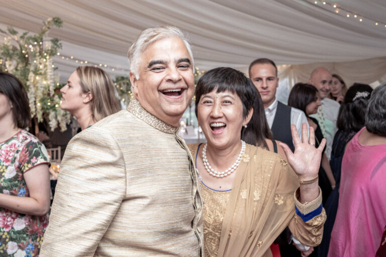 Family and friends on the dance floor in the marquee, Shooters Hill Hall, England, Victoria Amrose Photography