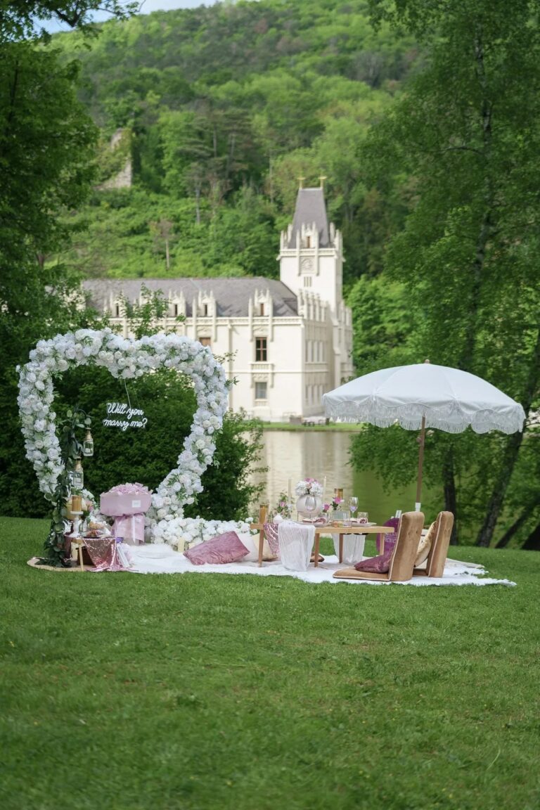 Heart-shaped flower arch and picnic on the lawn before a castle, Vienna Picnics