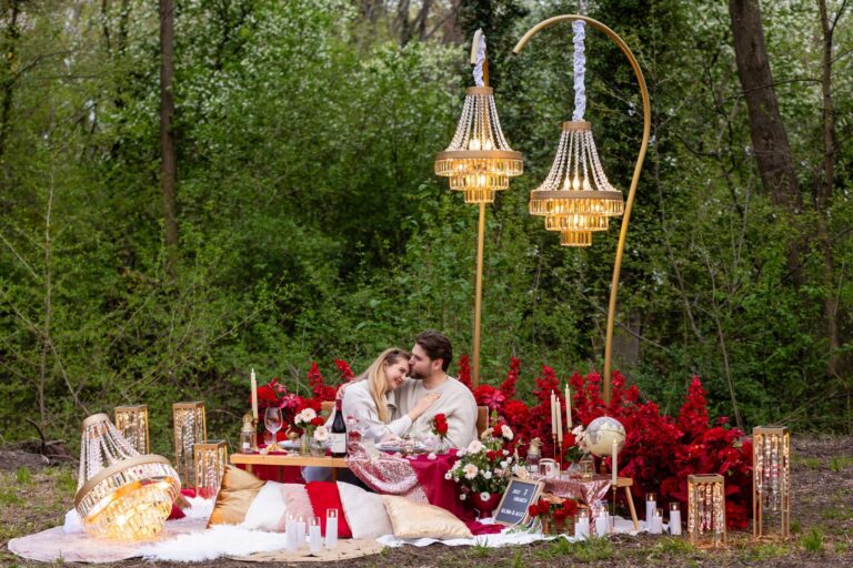 Red rose and gold chandelier proposal picnic in a spring woodland, Vienna Picnics