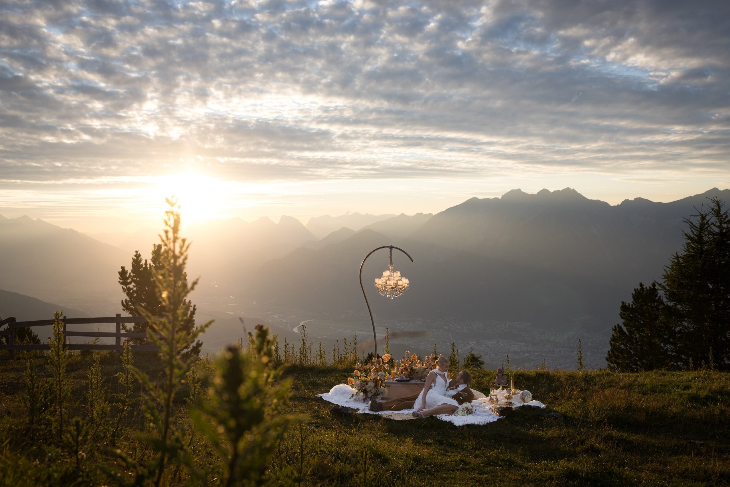 Chandelier picnic set-up on an alpine meadow at sunrise, Vienna Picnics