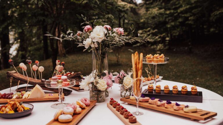 Dessert and canape table with flowers in the park, Vila Bled