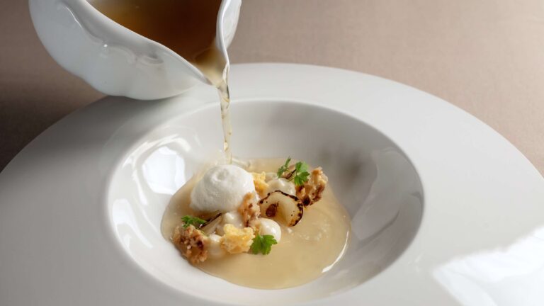 A plated course with sauce poured at the table, Vila Bled