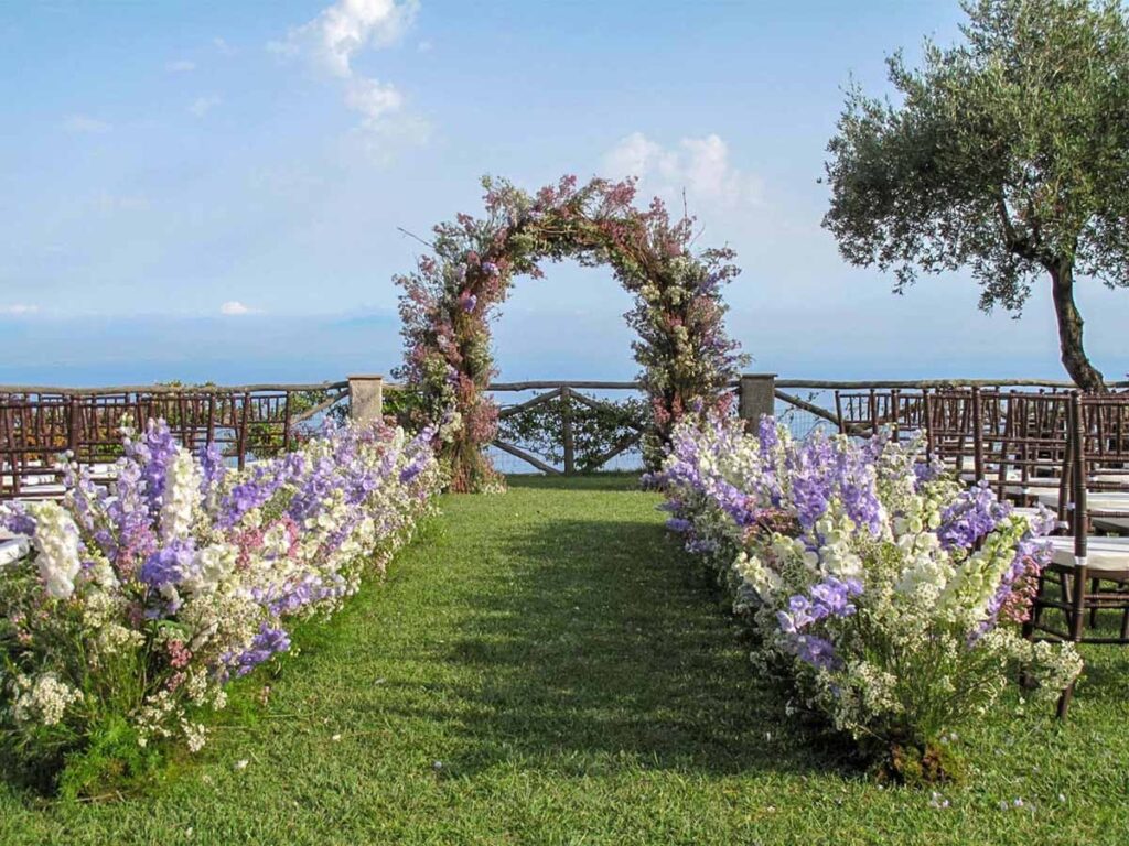 Flowered arch and aisle on the lawn above the sea, Villa Cimbrone