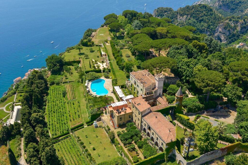 Aerial view of the villa, gardens and swimming pool above the coast, Villa Cimbrone