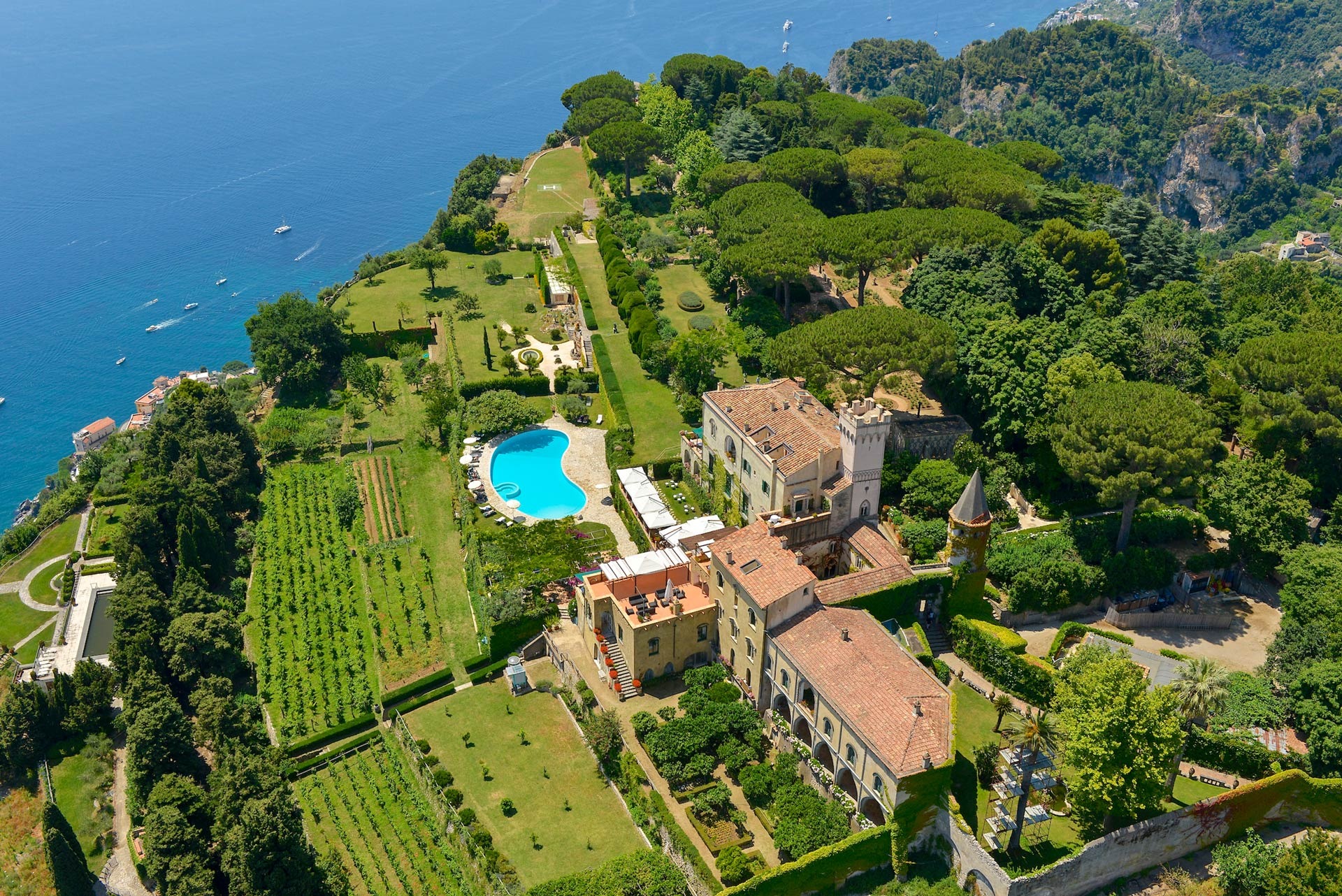 Aerial view of the villa, gardens and swimming pool above the coast, Villa Cimbrone