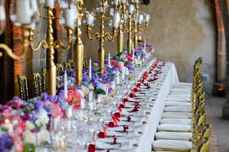 Banquet table with gold candelabra and flowers, Villa Cimbrone
