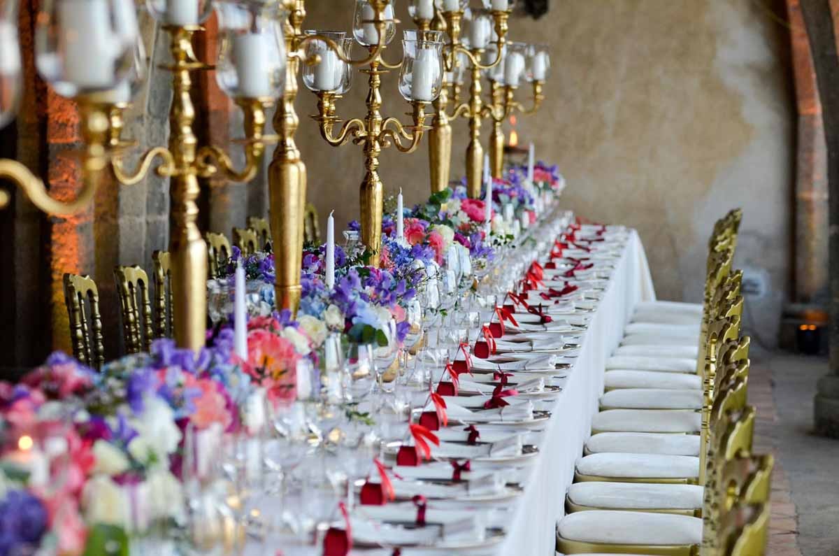 Banquet table with gold candelabra and flowers, Villa Cimbrone
