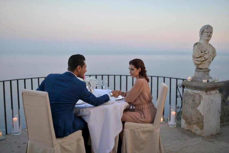 A couple at a candlelit table on the belvedere terrace, Villa Cimbrone