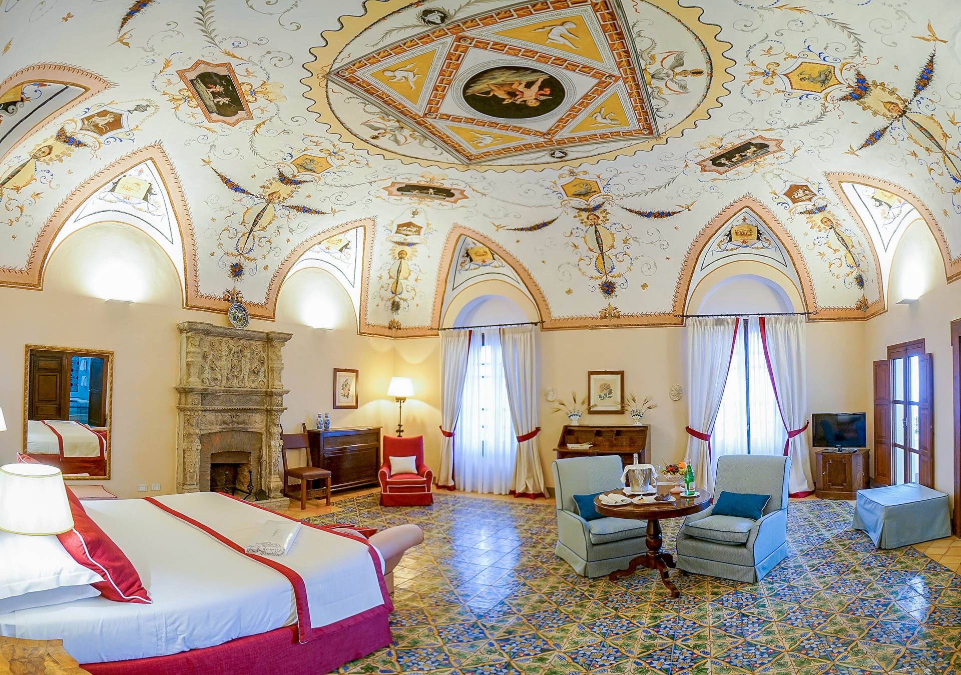 Suite with a frescoed ceiling and stone fireplace, Villa Cimbrone
