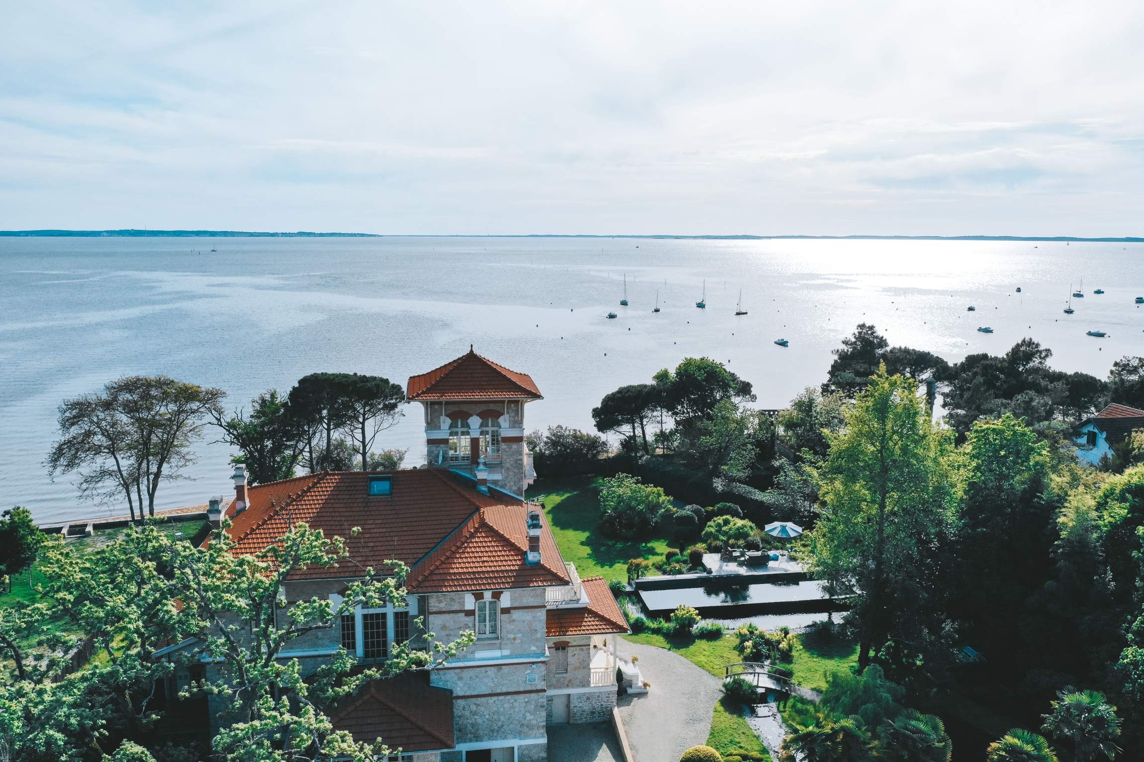 Aerial view of the villa and its garden above the Arcachon Bay, Villa la Tosca