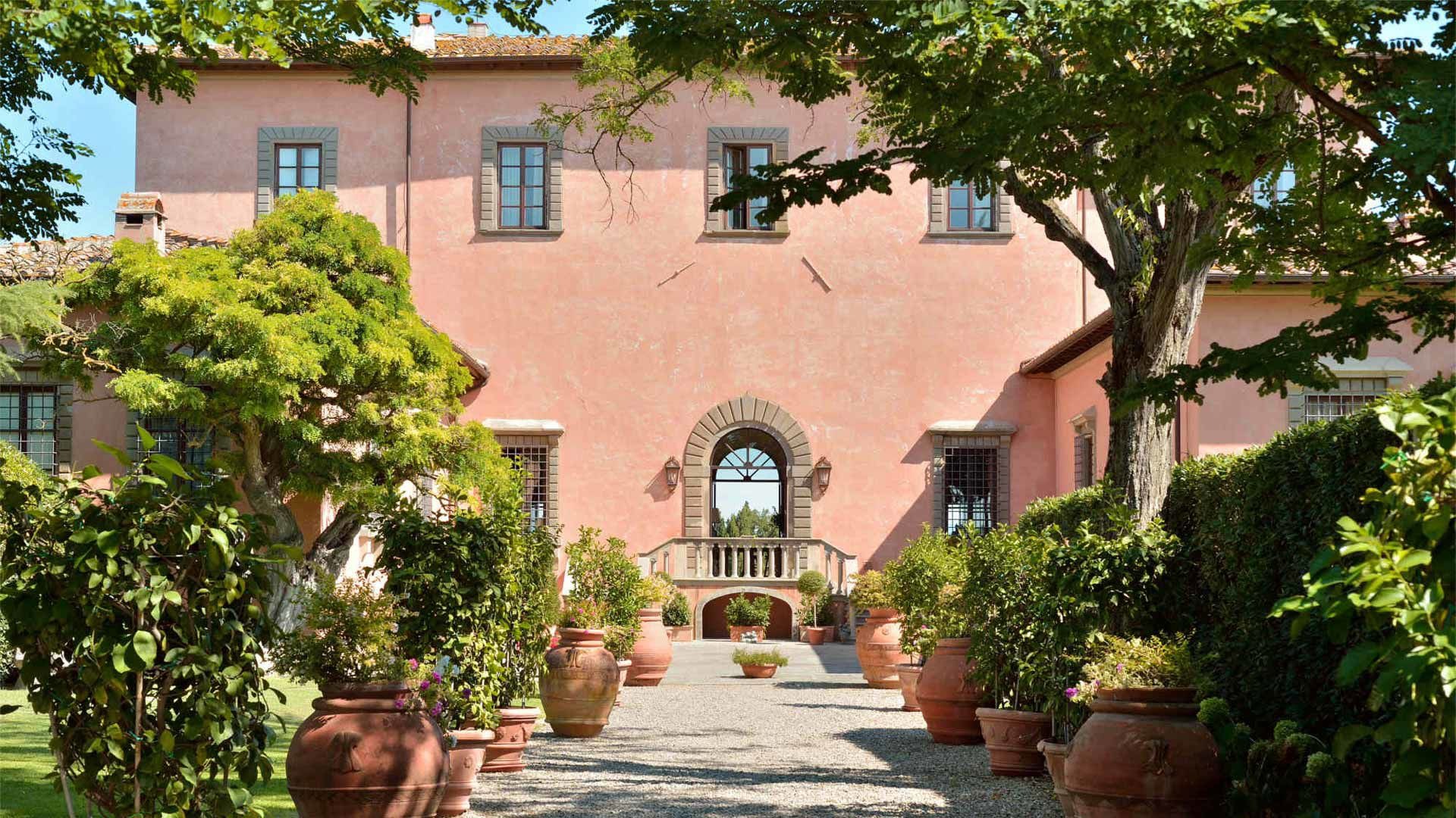 The peach-coloured facade and entrance courtyard, Villa Mangiacane