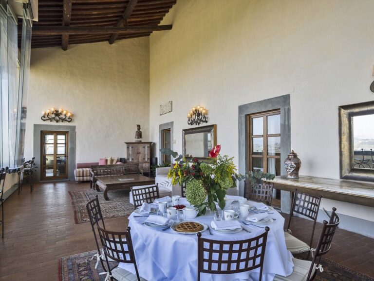 A round table laid in the loggia, Villa Mangiacane