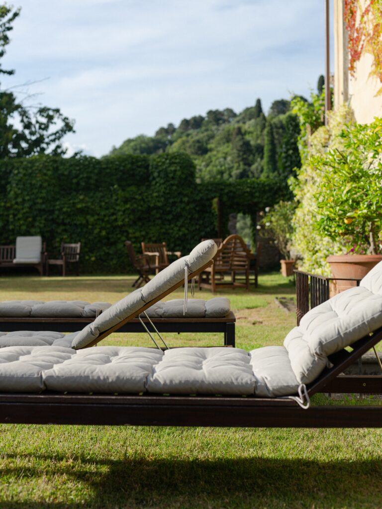 Garden loungers by the pool, Tuscan hills beyond, Villa Michaela