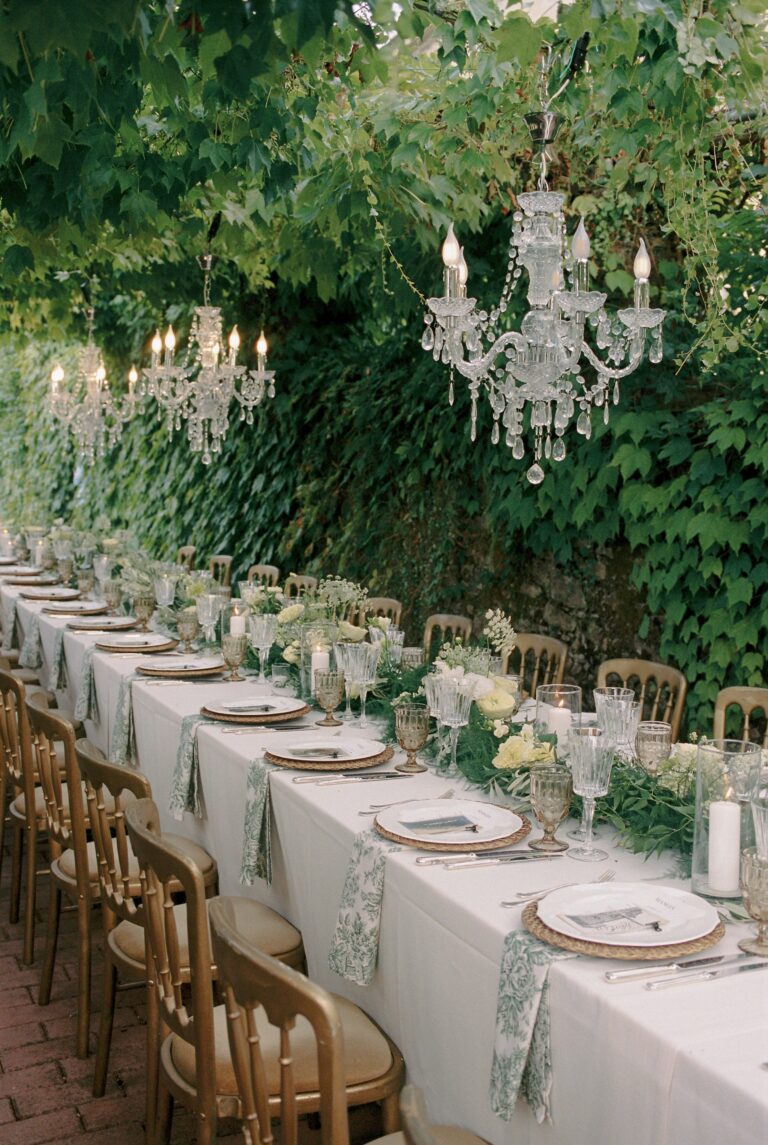 An outdoor dinner under crystal chandeliers and olive trees, Villa Michaela