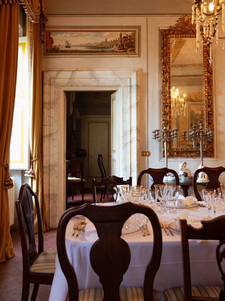 The formal dining room with crystal chandeliers and antique chairs, Villa Michaela