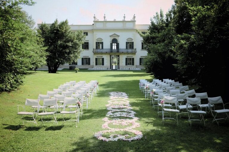 Chairs and a petal aisle in the secret garden, Villa Mosconi Bertani